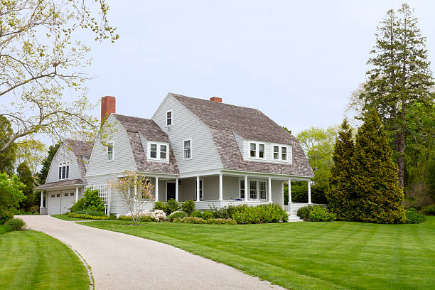 Landscape drainage pipe installation during patio project in Hingham Massachusetts by Land Design Associates