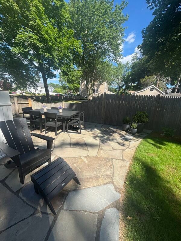 Professionally designed residential landscape in Duxbury, Massachusetts featuring native plantings and stone hardscape by Land Design Associates