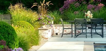 Professionally designed residential landscape in Duxbury, Massachusetts featuring native plantings and stone hardscape by Land Design Associates