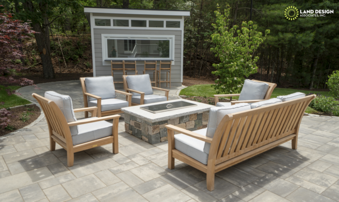 Massachusetts landscape contractor hardscape project with bluestone patio and retaining wall