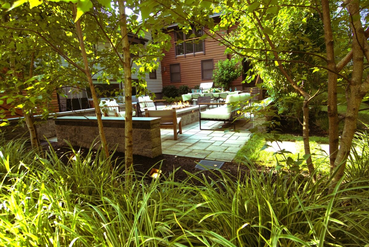 Professional landscape design plan and completed backyard installation for a Massachusetts home by Land Design Associates