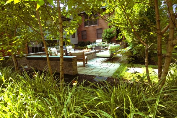 Professional landscape design plan and completed backyard installation for a Massachusetts home by Land Design Associates
