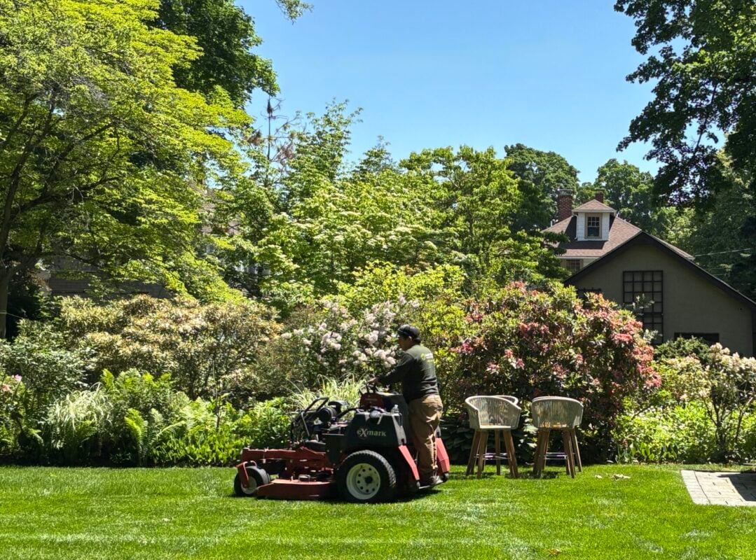 Weekly mowing cost example: crew mowing and edging a residential lawn in Massachusetts
